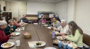 People seated around table