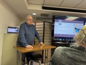 Man standing near screen