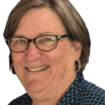 Smiling woman in patterned shirt