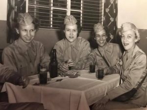 Photo of four WAC women at a table with drinks